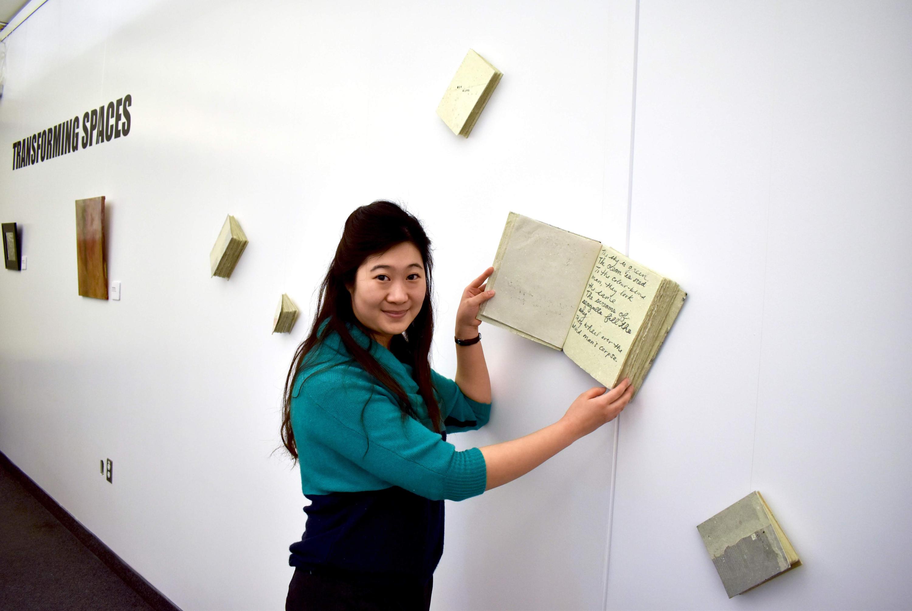 Artist with book installation