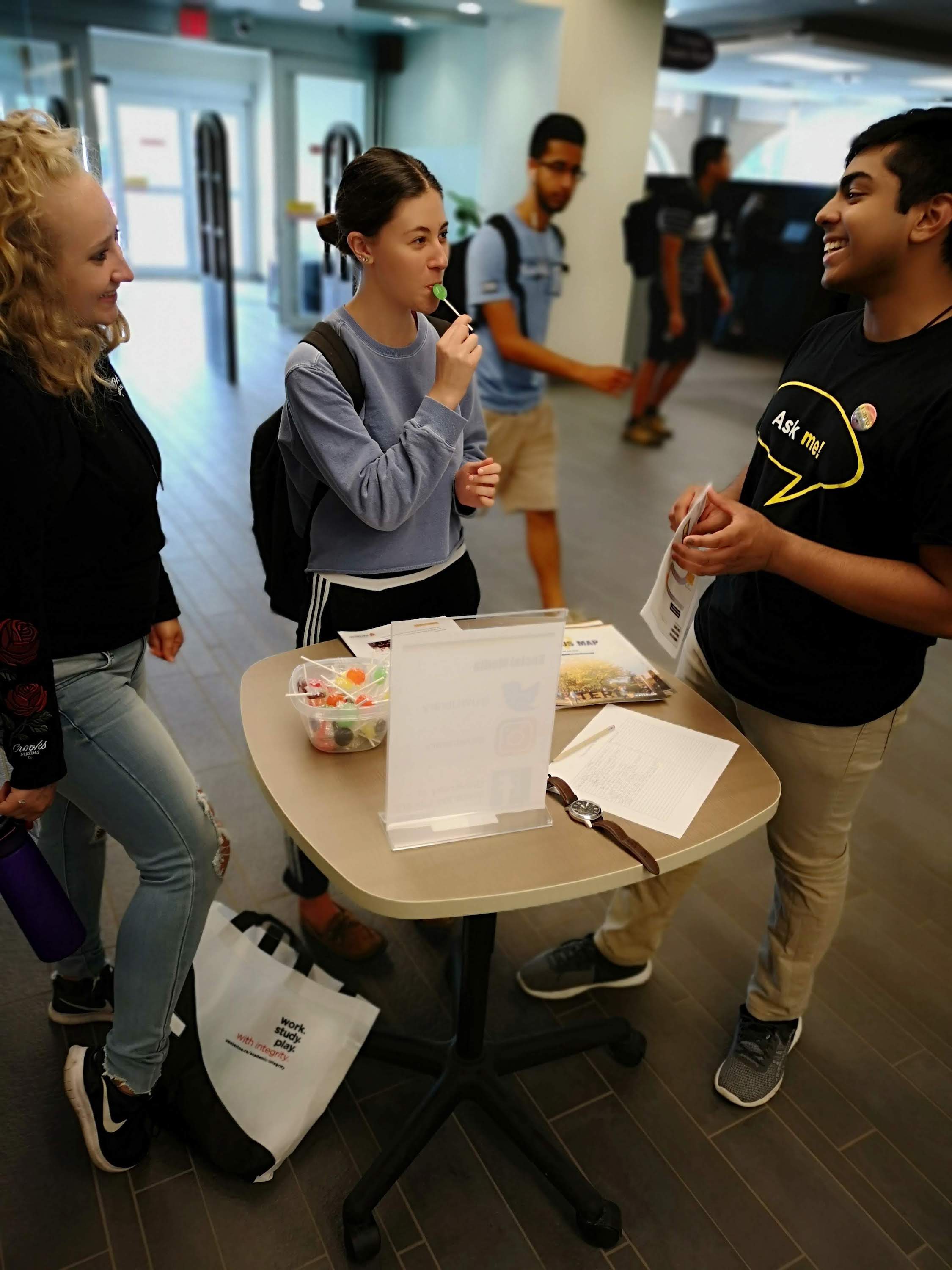 talking to student in the library