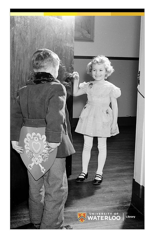 Option 2 - Young boy holding valentine behind his back about to give it to smiling young girl