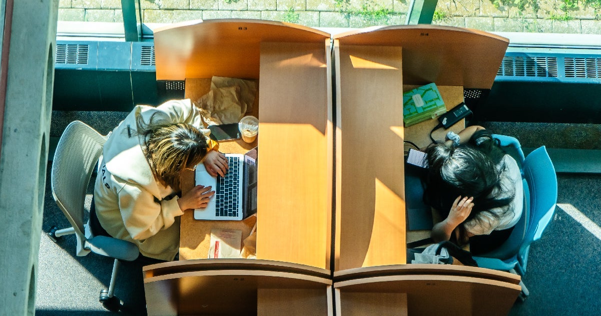 an aerial view of two students studying in Davis Centre Library