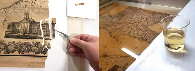 a cup of light coloured liquid beside a vintage map