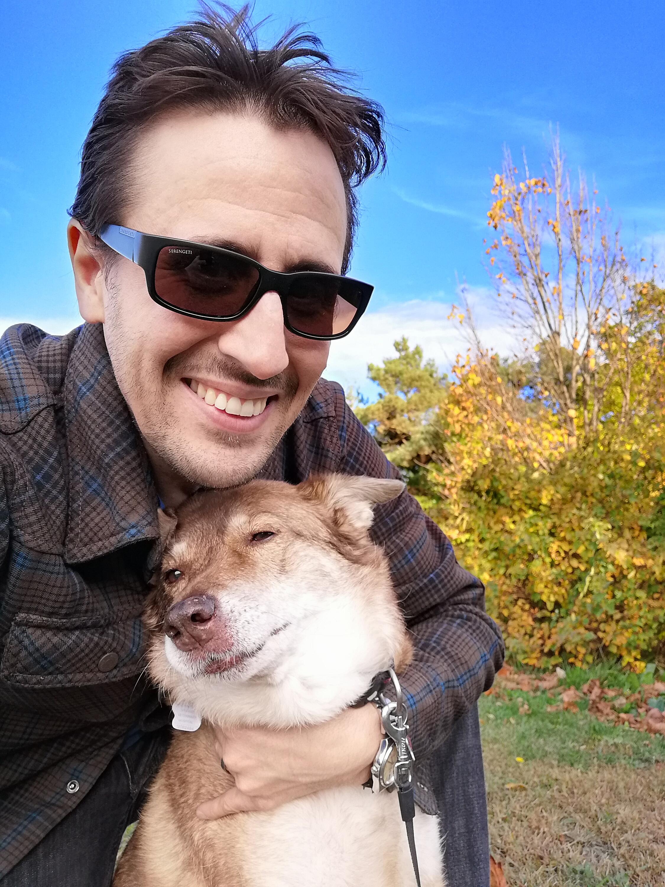 Tim with his dog outside. 