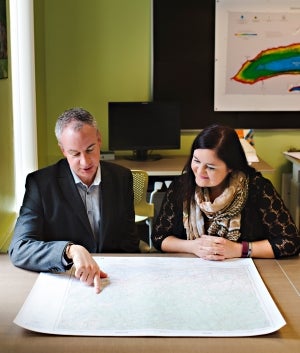 Nick Richbell and Eva Dodsworth viewing a map in the Geospatial Centre