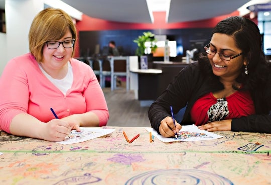 Mary Lynne Bartlett and Vedika Bhandari, student library ambassador