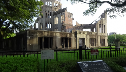 A ruined building stands as a reminder of the lives lost in the Hiroshima bombing at the Hiroshima Peace Memorial. 