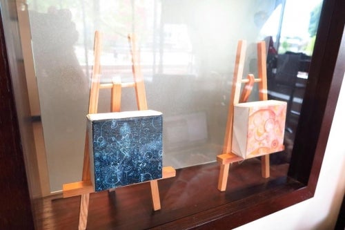 Two small painted canvases displayed as part of the off hours exhibition.