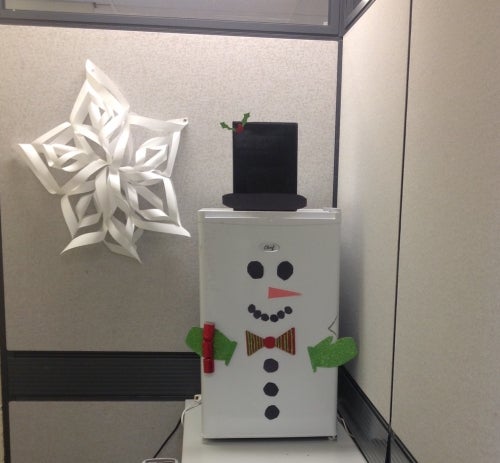 Snowman decoraton on a mini fridge
