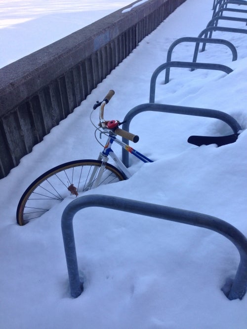 Bicycle buried in the snow