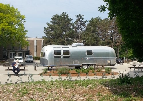 Airstream trailer parked in front of Dana Porter Library