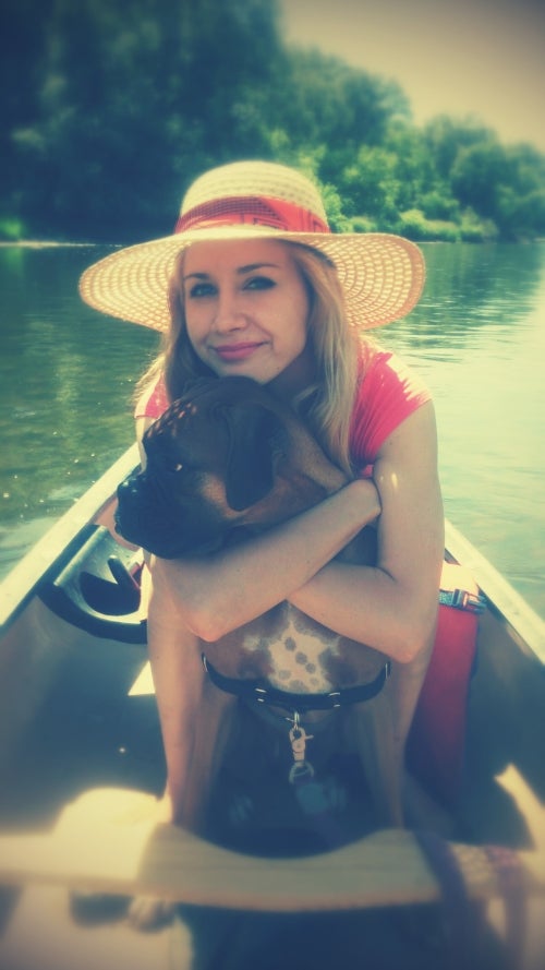 woman and dog in canoe