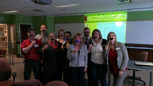 library staff with mustaches