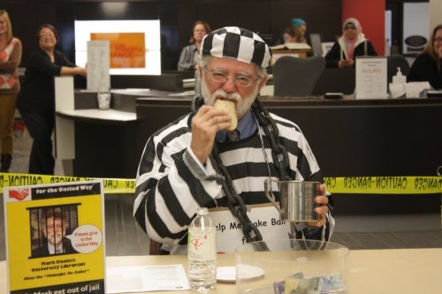 person dressed in striped prison costume