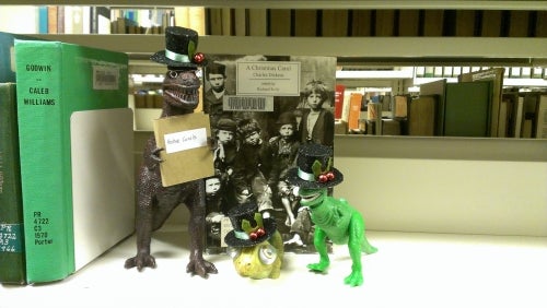 dinosaur toys in the library stacks
