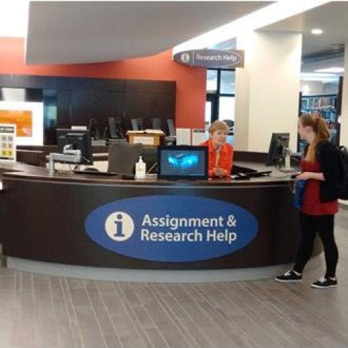 New 'Assignment and Research Help Desk' sign at the Porter info desk.