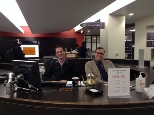Staff at the Information Desk in the Porter LIbrary.
