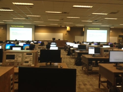 Picture of a classroom with many screens and learning technology.
