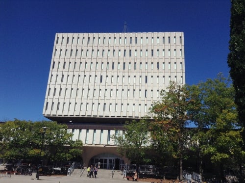 Picture of the Dana Porter library against a solid and bright blue sky.