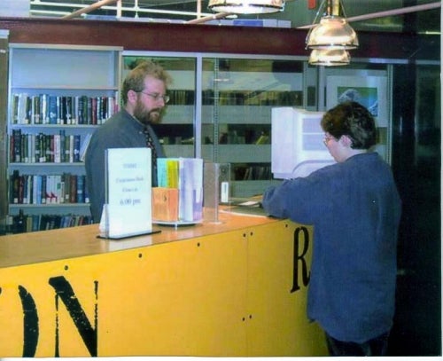 Ted Harms at the Davis Circulation desk