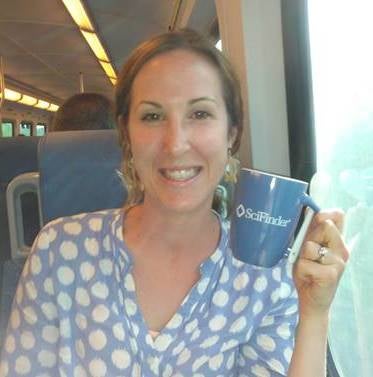 Laura on the train holding mug