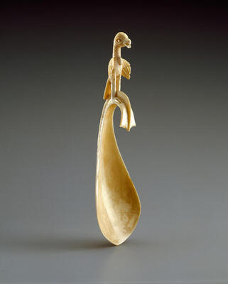 wooden carved spoon with bird at the top