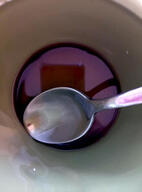 spoon in a bowl of liquid