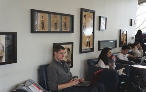 Students in lounge by the display