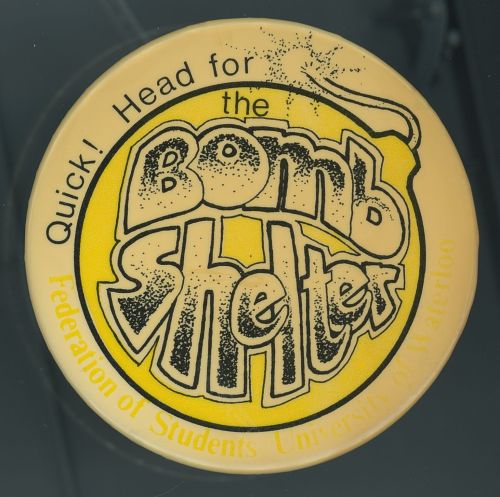 Bombshelter Pub button [between 1974 and 1980]