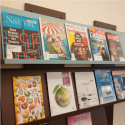magazines on shelf in Peter &amp; Betty Sims Reading Room