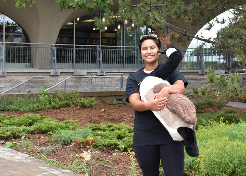woman holding Canada goose