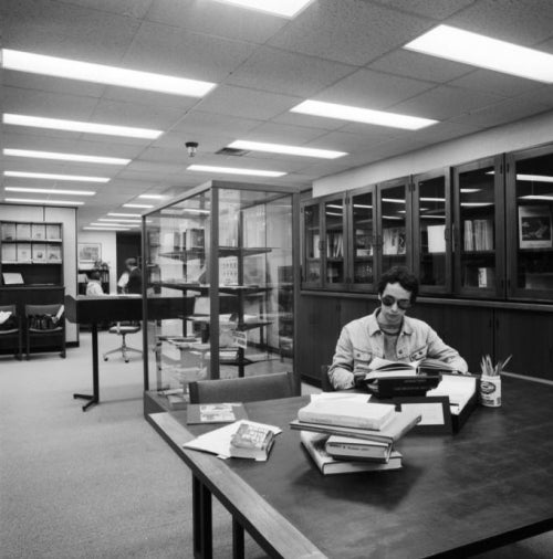 Student studying at a table in the rare book room