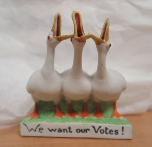 Statue of geese honking, with inscription &quot;we want our votes&quot;