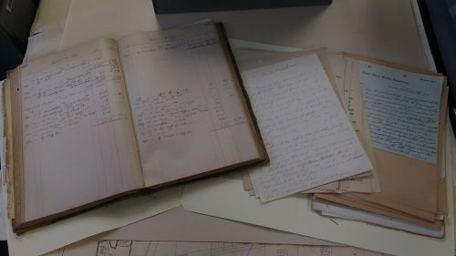 A ledger, some letters, and and some legal documents