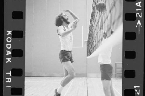 Two people practising volleyball
