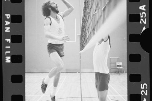 Two people practising volleyball