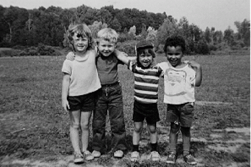 Children with arms around one another.