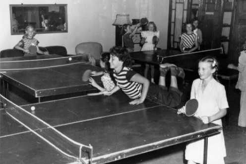 Girls playing table tennis.