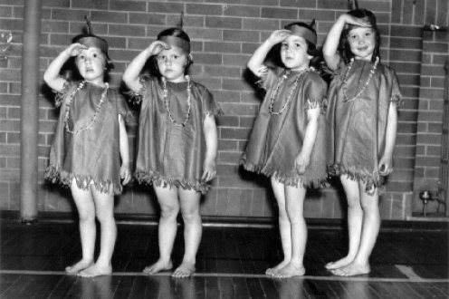 Young girls in costume.