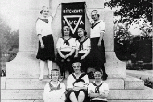 Women holding YWCA Kitchener sign.