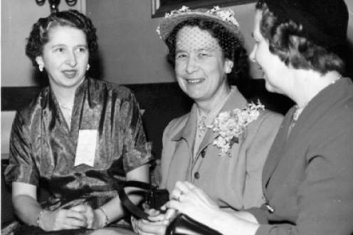 Three women at annual meeting.