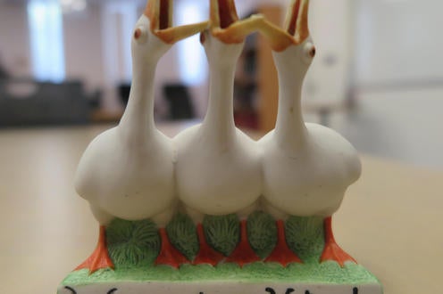 Porceleine vase demonstrating three geese honking, underneath them it says "We want our votes"