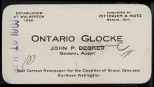 John P. Becker business card.