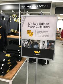 W Store sign for the Limited Edition Retro Collection along with some items of clothing branded with UW