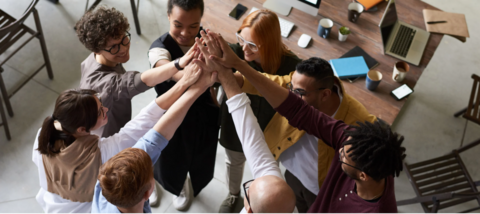 group of people with hands together