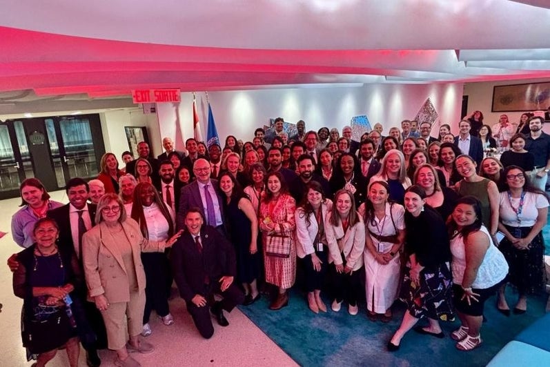 Group picture of 60 people at the Canadian mission in New York