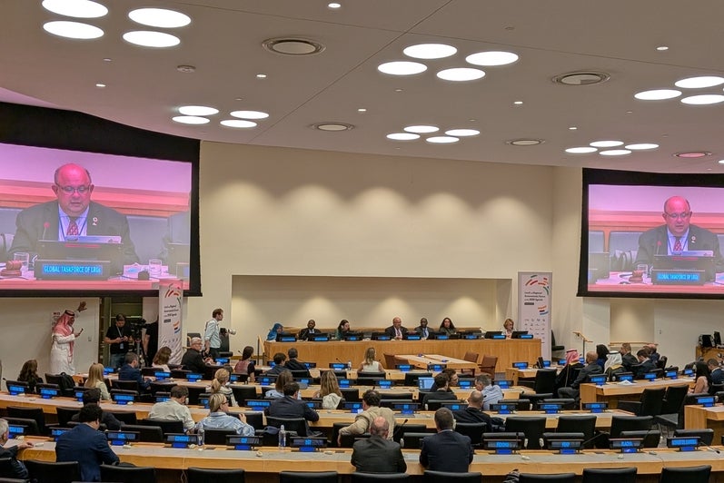 watching a speaker present at the UN