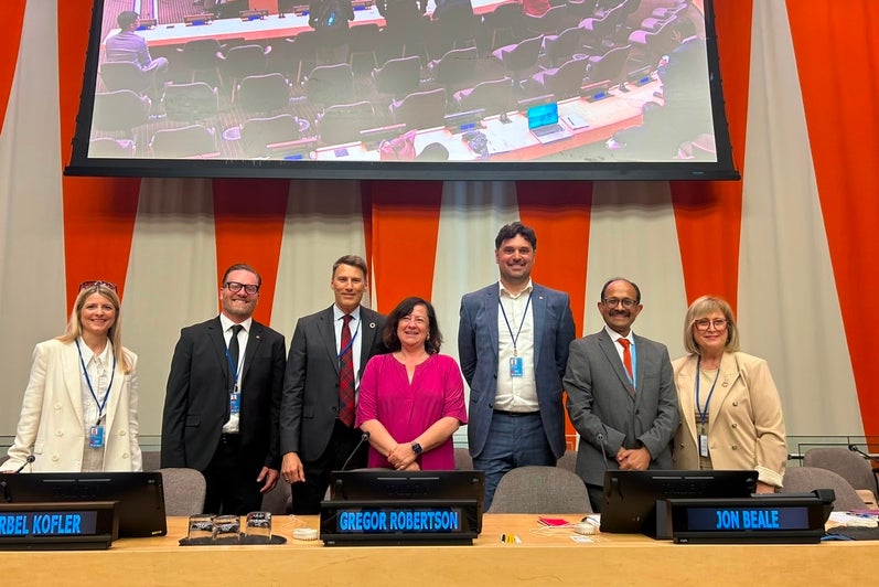 panelists posing after the event at the UN