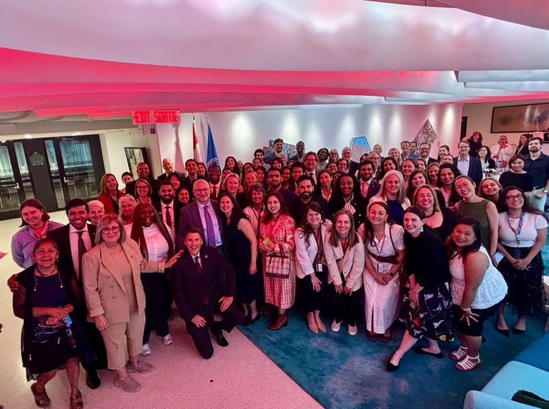 Group picture of 60 people at the Canadian mission in New York