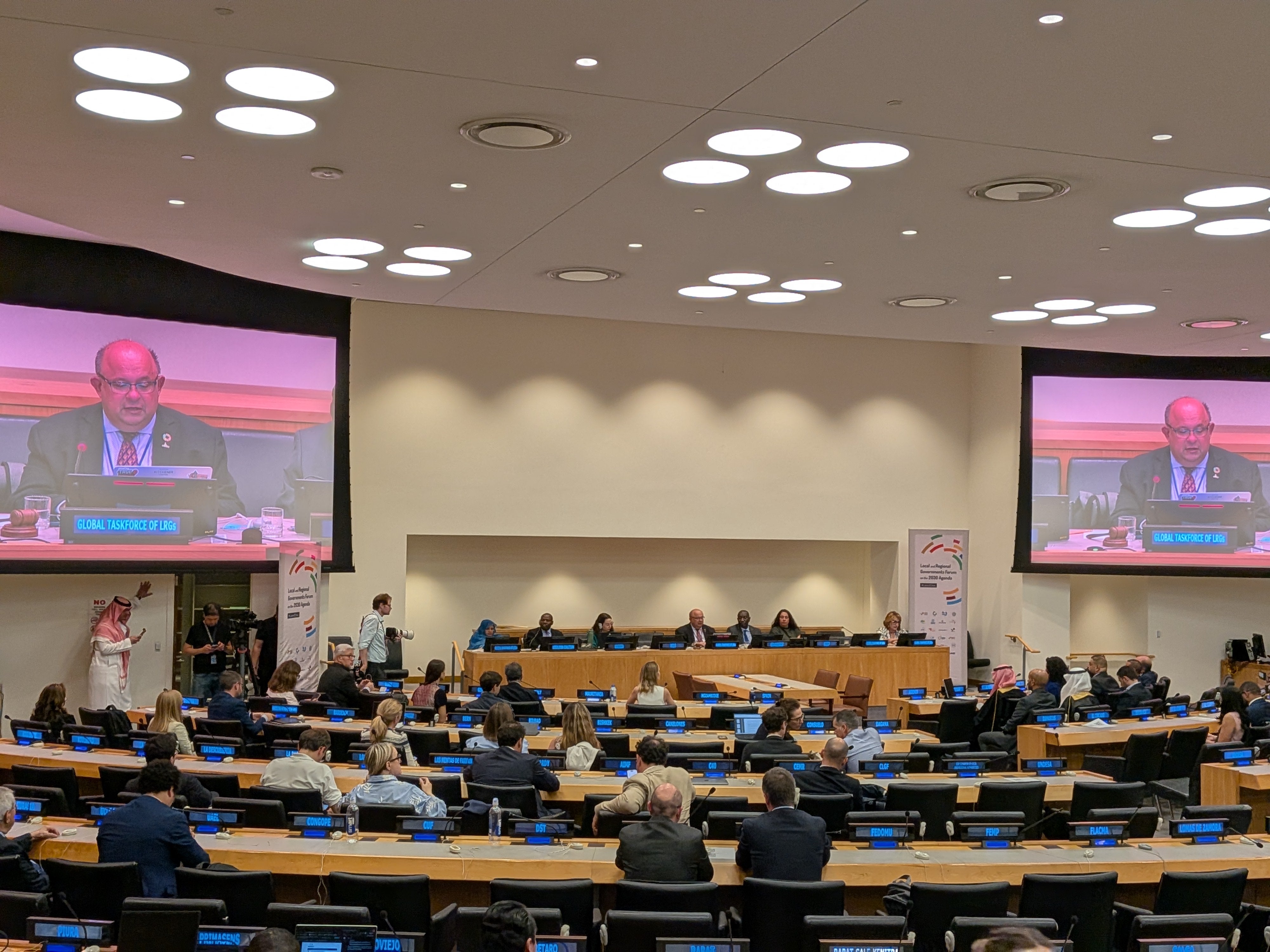 watching a speaker present at the UN