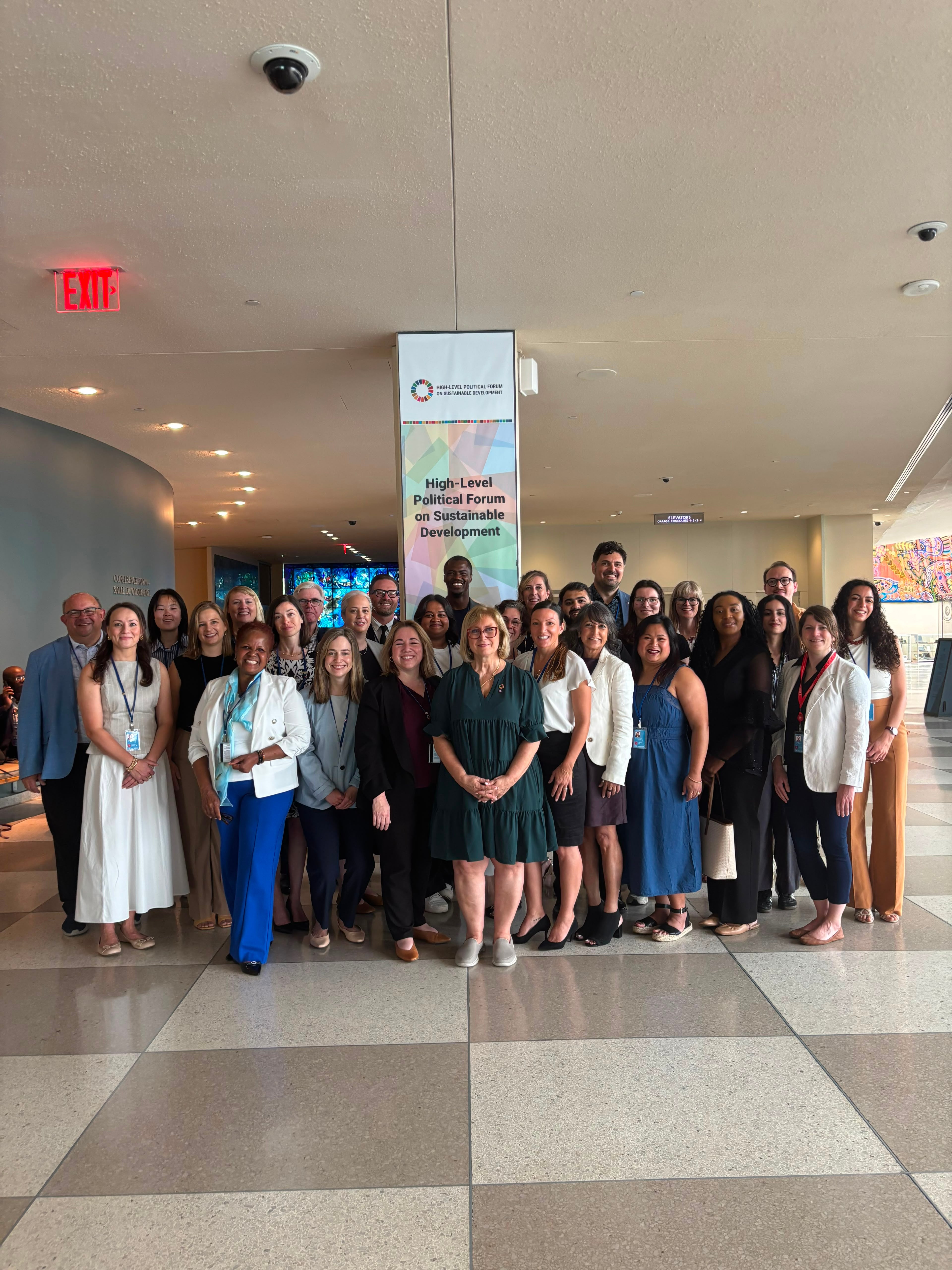 Canadian delegates standing for a photo