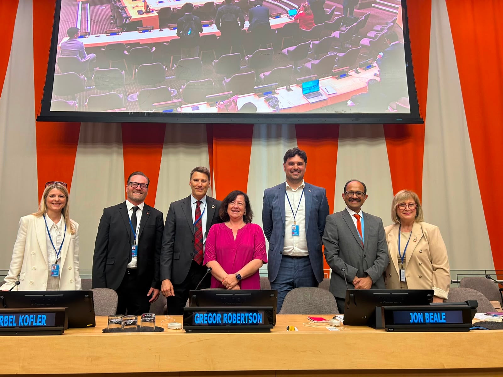 panelists posing after the event at the UN